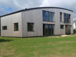 Maison bois toit cintré Finistère Trégana